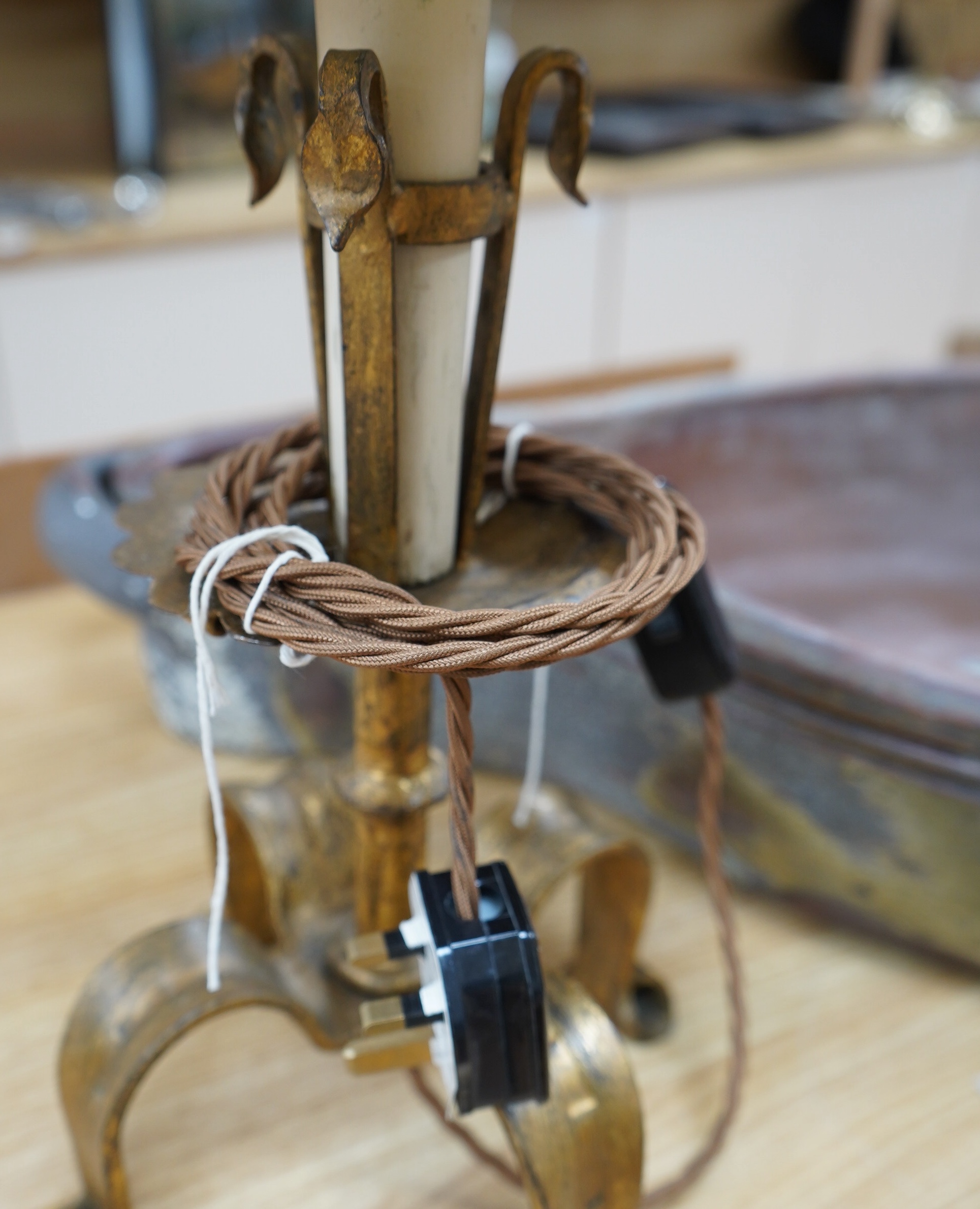 A Spanish single gilded wrought iron table lamp with fabric shade, wired, 51cm to top of shade. Condition - good.